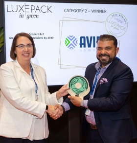 two people holding an award