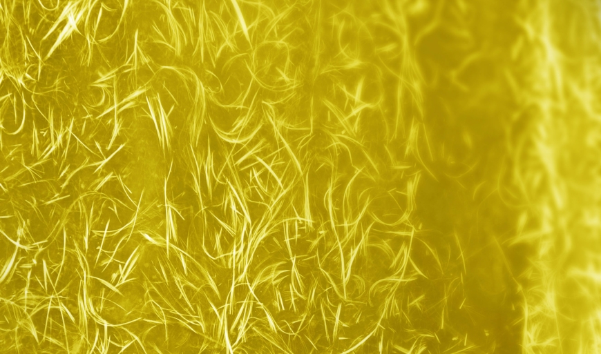 Surface Covered With Yellow Feathers As A Background Texture