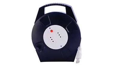 Black circular extension cord reel with a top handle, featuring a white center panel with two power outlets and a red button.