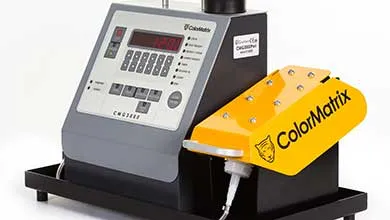 ColorMatrix CMG3000 machine with a gray control panel, digital display, and a bright yellow dispensing unit showing the brand logo.