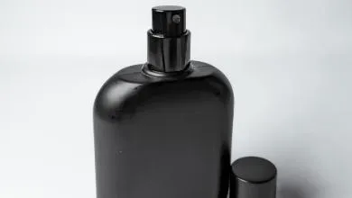 Black spray bottle on white background