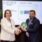 two people holding an award